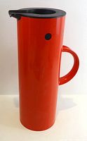 Full view of red Stelton vacuum jug with handle