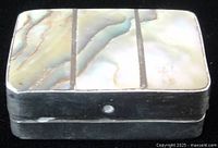 Top view showing abalone inlaid lid in three rectangular segments within sterling frame