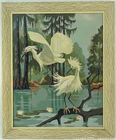 Full view of framed paint-by-number artwork showing egrets over water