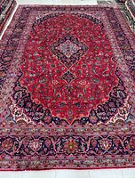 Full view of entire Persian Kashan rug showing overall design and size