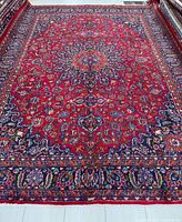 Full view of handmade Mashhad Persian rug showing entire pattern and border