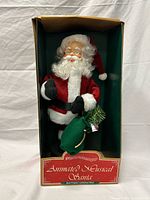 Front view of boxed animated musical Santa