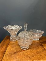 Three cut crystal pieces on table