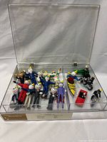 Display case with all figurines and vehicles visible