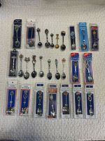 Full layout showing all 31 spoons, carded and loose