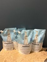 Front view of four Method Foaming Hand Wash refill pouches