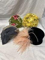 All four vintage hats displayed together