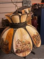 Full view of hanging stained glass lamp showing panels and design