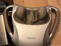 Top view showing HoMedics shiatsu massager with handles and fabric massage nodes