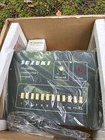 Control console in box with AC adapter visible