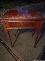 Front view of Singer wooden sewing table