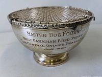 Front view showing engraving on silver-plated trophy bowl