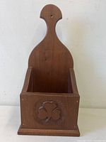 Front view showing clover carving and overall design