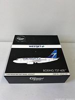 Closed retail box showing WestJet Boeing 737-600 image and Gemini 200 branding