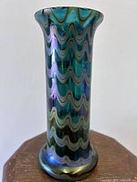 Full front view showing wavy iridescent pattern and flared rim