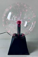 Front view of plasma lamp showing globe activated