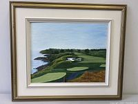 Front view of framed golf course painting