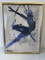 Full view of framed art print showing gold frame and artwork