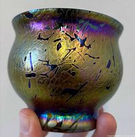 Front view of iridescent art glass vase