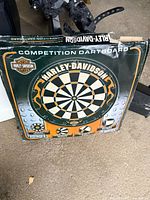 Front of opened Harley-Davidson competition dartboard box