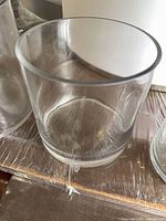 Overall view of clear cylindrical glass vase