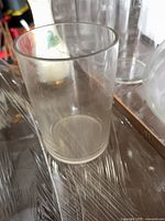 Side view of clear cylindrical glass vase
