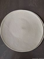 Single placemat showing spiral woven texture and color