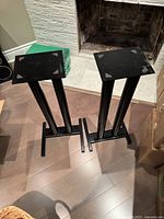 Pair of black steel speaker stands, full view