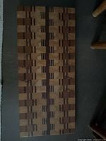 Top view of entire wooden board showing geometric end-grain pattern