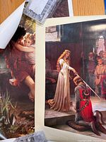 Both posters partially overlapped showing full image of The Accolade and partial image of embracing couple
