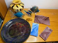 Group shot with vase, platter, fish figurines, napkin rings, three sun catchers