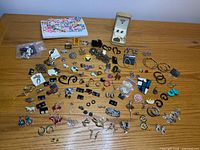 Full spread showing all jewelry pieces laid out on table