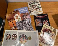 All magazines, books, and pattern sets spread on tabletop