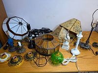 Overview of all lamp bases, shades, covers, puck lights on tabletop