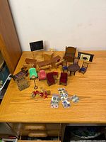 Group view of all miniature furniture on tabletop