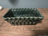 Planter front view showing diamond relief and green glaze