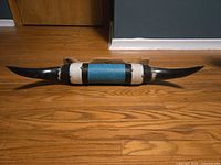 Full view of mounted steer horns on floor