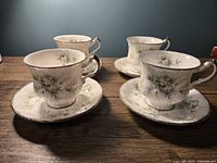 Four Paragon “First Love” teacups on saucers, front angle