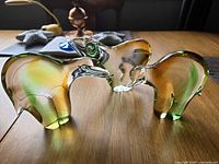 Three aurora borealis style glass bears standing on tabletop