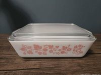 Side view showing pink Gooseberry pattern on white dish with lid