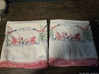 Both pillowcases laid flat showing embroidery, text, and lace trim