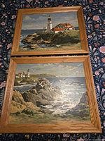 Both framed lighthouse paint-by-number paintings side by side