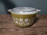 Side profile of casserole showing floral pattern and lid