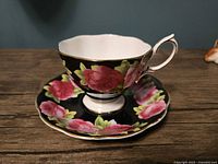 Teacup on saucer showing front floral design
