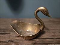 Overall view of brass swan ashtray dish
