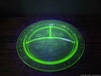 Top view under black light showing full plate fluorescence and etched border