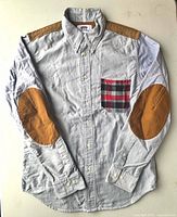 Front view showing full shirt with pocket, elbow patches and collar