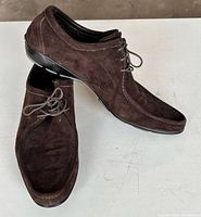 Shoes angled showing suede upper and sole