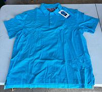 Front view of Robert Graham turquoise polo shirt laid flat