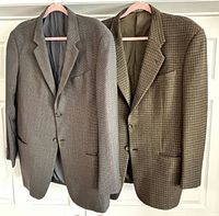 Both blazers hanging side by side showing colors and patterns